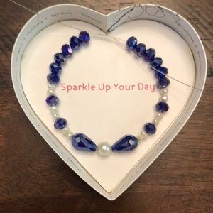 Purple and white beads bracelet.